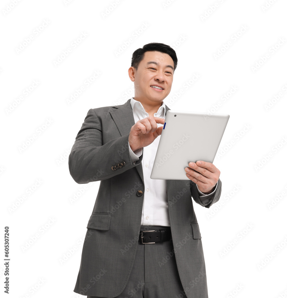 Businessman in suit using tablet on white background, low angle view Businessman in suit using tablet on white background, low angle view