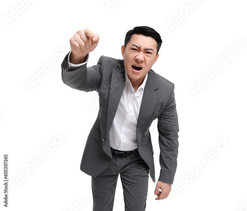 Angry businessman in suit screaming on white background, low angle view