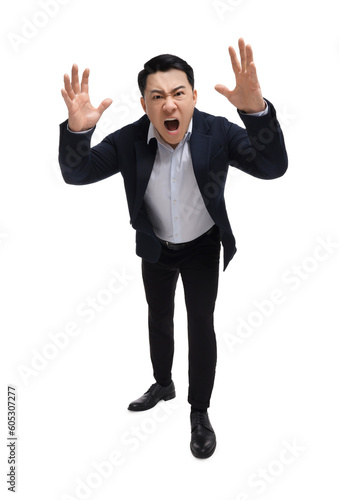 Angry businessman in suit screaming on white background, low angle view