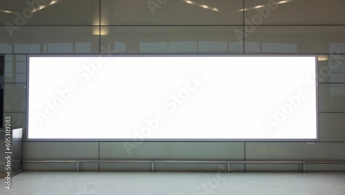 Closeup shot of a white blank billboard in a horizontal position in a modern building