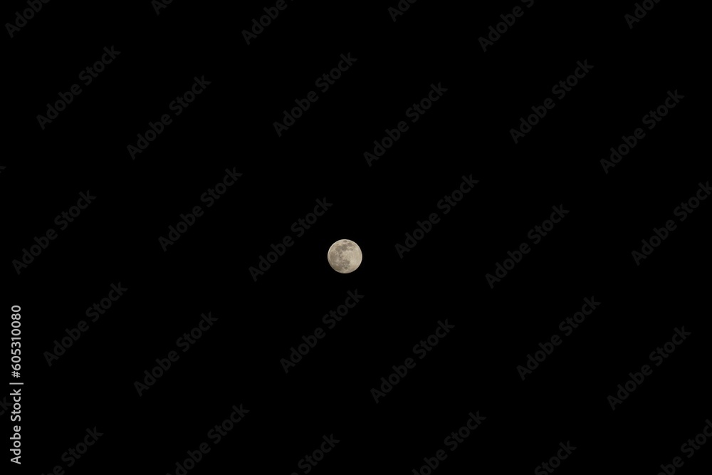 Spectacular full moon in the dark black sky with copy space Spectacular full moon in the dark black sky with copy space