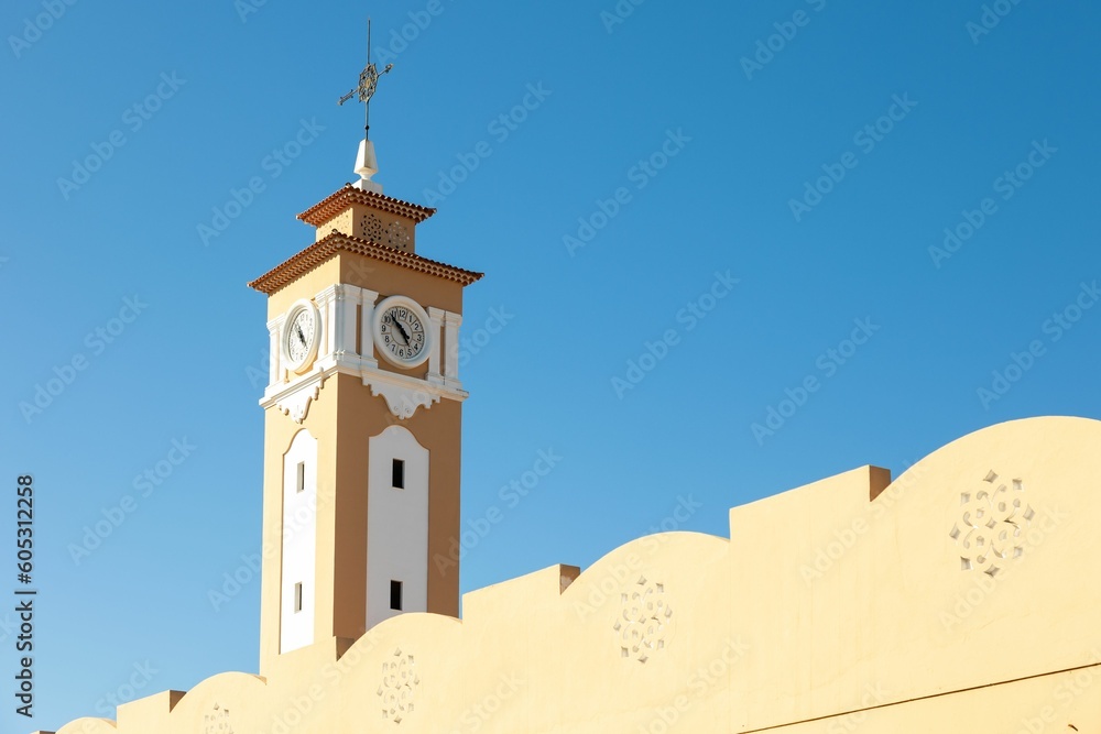 Clock tower against a blue sky