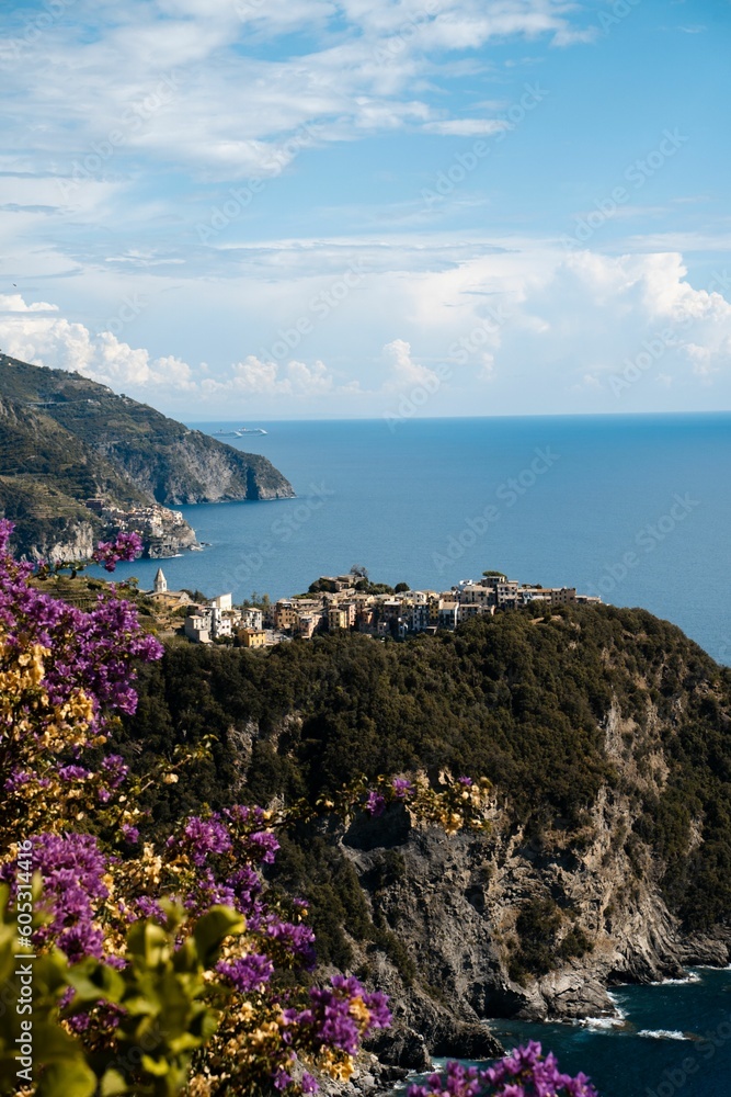 Vertical shot of the coastal village and mountainous islands in Corniglia, Cinque Terre, Italy