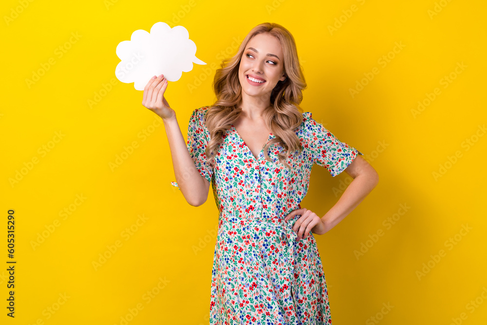 Portrait of adorable cheerful lady wear trendy sarafan showing empty space interesting thoughts isolated on yellow color background Portrait of adorable cheerful lady wear trendy sarafan showing empty space interesting thoughts isolated on yellow color background