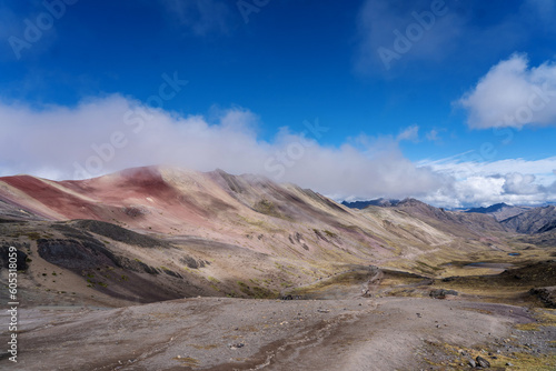 rainbow mountains in peru with clouds - view on the way