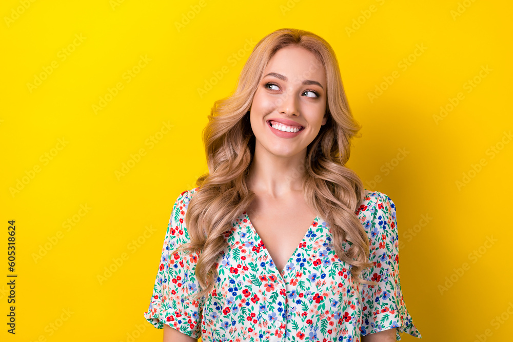 Photo of adorable cute nice lady dressed bright clothes looking empty space interesting proposition isolated on yellow color background Photo of adorable cute nice lady dressed bright clothes looking empty space interesting proposition isolated on yellow color background