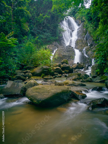 Fototapeta Naklejka Na Ścianę i Meble -  Extraordinary beauty, enjoying the waterfall in Kuningan, West Java, 23 May 2023. Kuningan, paradise for hidden waterfalls