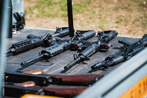 Firearms, m4a1 and ak47 rifles in the car trailer. photo