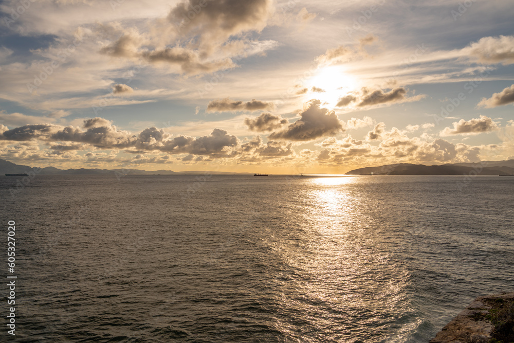 Naklejka premium bright sky with clouds over the ocean by Gibraltar with ships