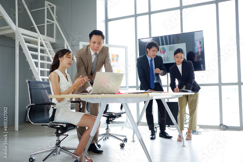 Business team working at desk using laptop to work