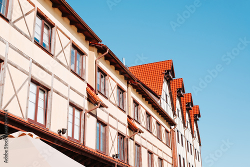 Ancient houses with a tiled roof on a sunny day, facade german architecture