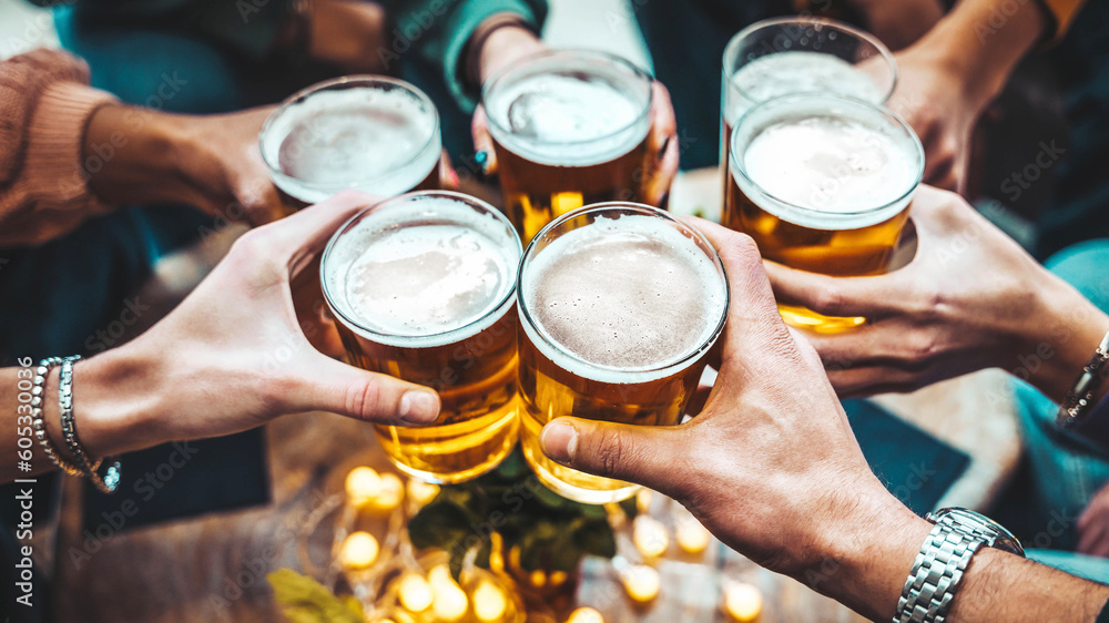 Group of people drinking beer at brewery pub restaurant - Happy friends enjoying happy hour sitting at bar table - Closeup image of brew glasses - Food and beverage lifestyle concept - obrazy, fototapety, plakaty 