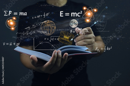 Hands writing in notebooks on dark the background physics and math equations floating on the background, representing the learning teaching or scientific notes of Albert Einstein and Sir Isaac Newton.