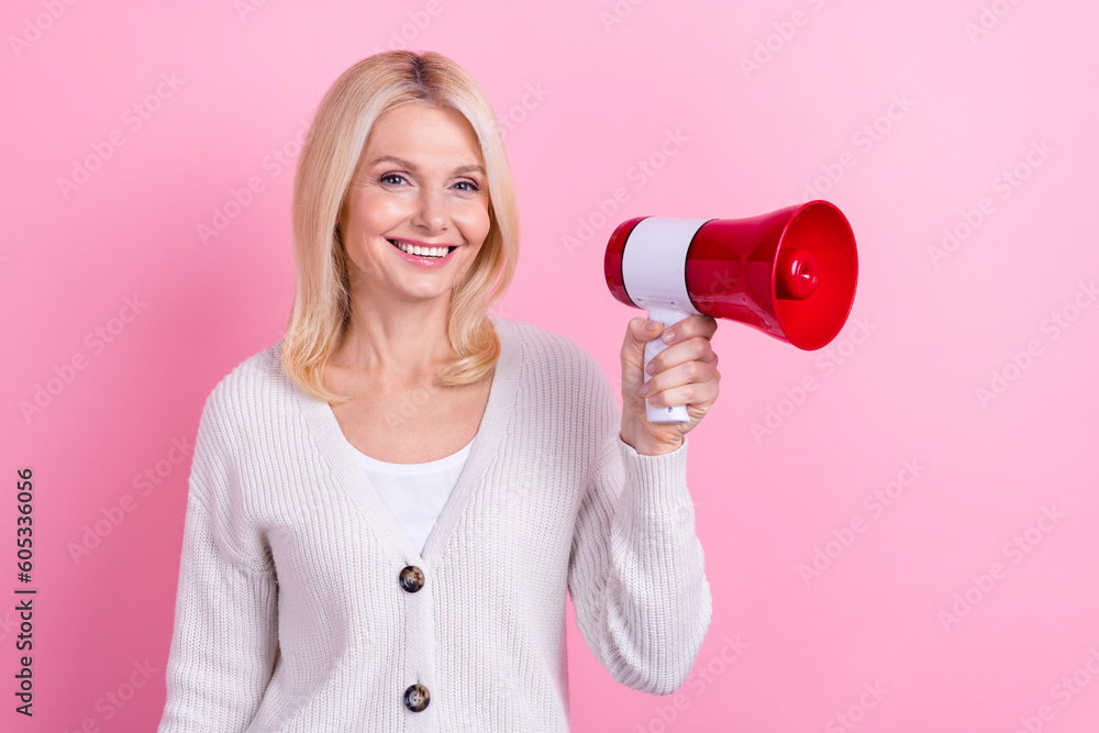 Portrait of pleasant friendly nice person dressed white sweater hold megaphone announcing big sale isolated on pink color background Portrait of pleasant friendly nice person dressed white sweater hold megaphone announcing big sale isolated on pink color background