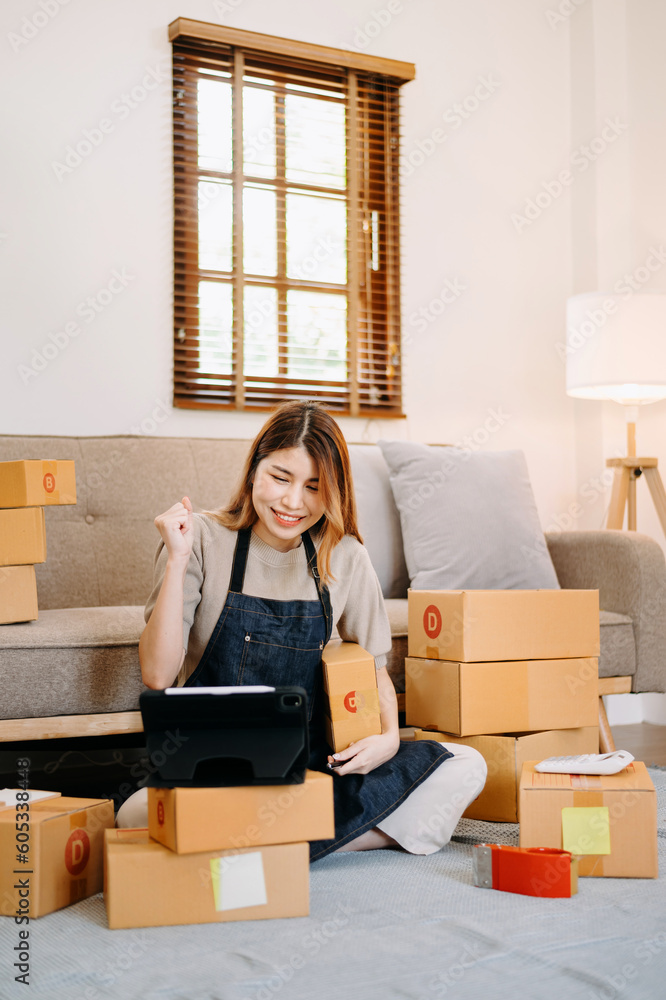 Small business entrepreneur SME freelance woman working at home office, BOX,tablet and laptop online, marketing, packaging, delivery, concept. Small business entrepreneur SME freelance woman working at home office, BOX,tablet and laptop online, marketing, packaging, delivery, concept.