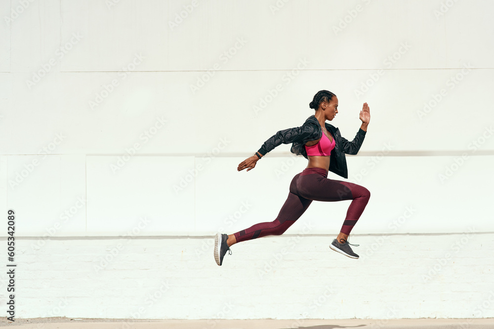 Woman, fitness and running jump action on mockup for cardio training, exercise or workout outdoors. Fit, active and sporty female person or runner exercising for health and wellness on mock up space