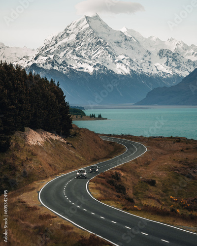 Scenic winding road along Lake Pukaki to Mount Cook National Park, South Island, New Zealand during cold and windy winter morning. One of the most beautiful viewing point of Aoraki Mount Cook.
