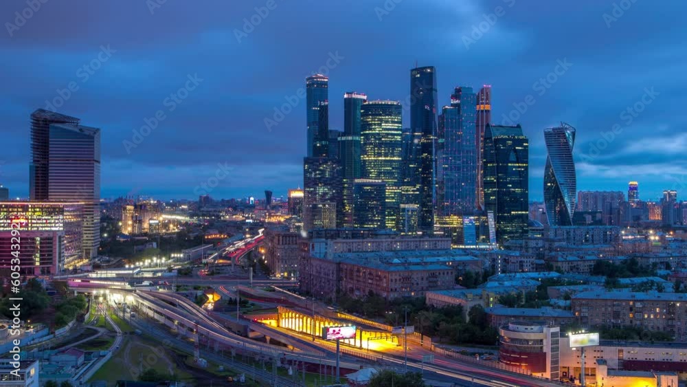 Night to day transition view of the city traffic timelapse and Skyscrapers of Moscow International Business Center (Moscow-City). Aerial top view from rooftop near Kievskiy railway station Night to day transition view of the city traffic timelapse and Skyscrapers of Moscow International Business Center (Moscow-City). Aerial top view from rooftop near Kievskiy railway station