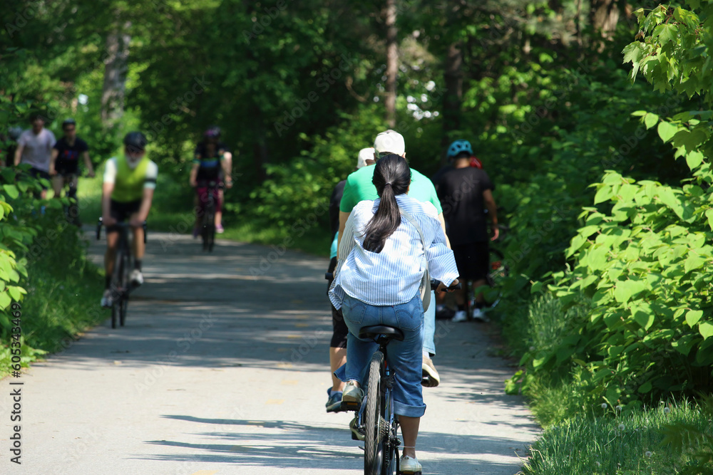 People cycling, Jogging and walking on the bikeway in the sunny day