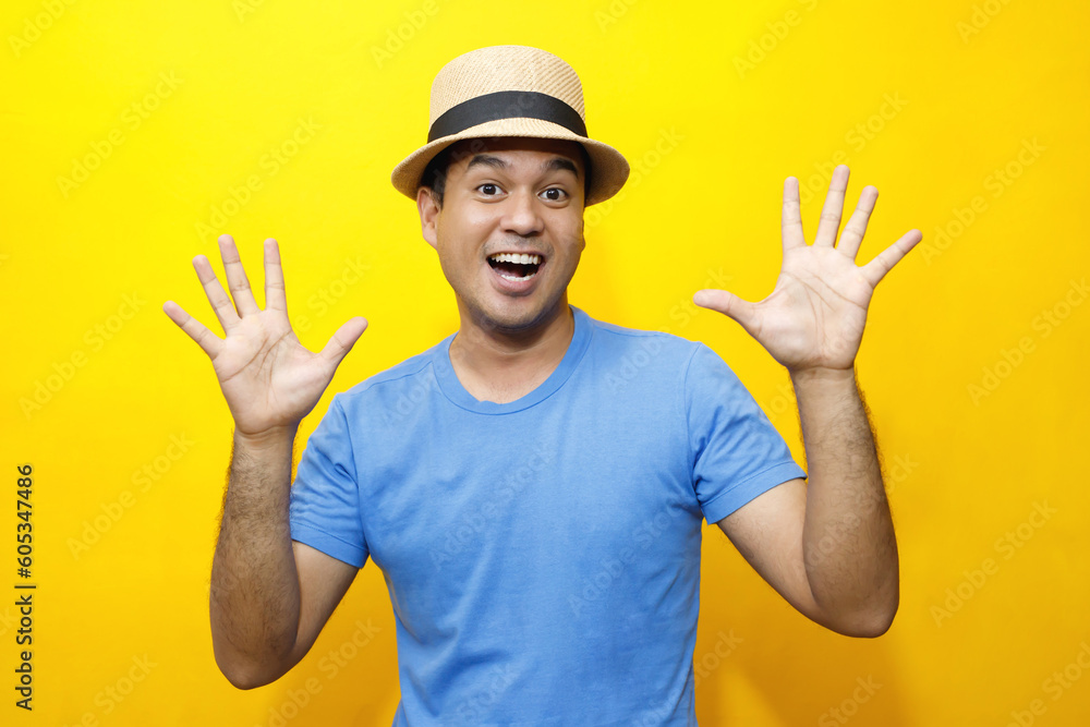 Portrait of Hipster young man young happy man casual dress blue striped t-shirt and wear a hats. Gesture emotion extend the arms shy modest on studio portraits set color yellow background.