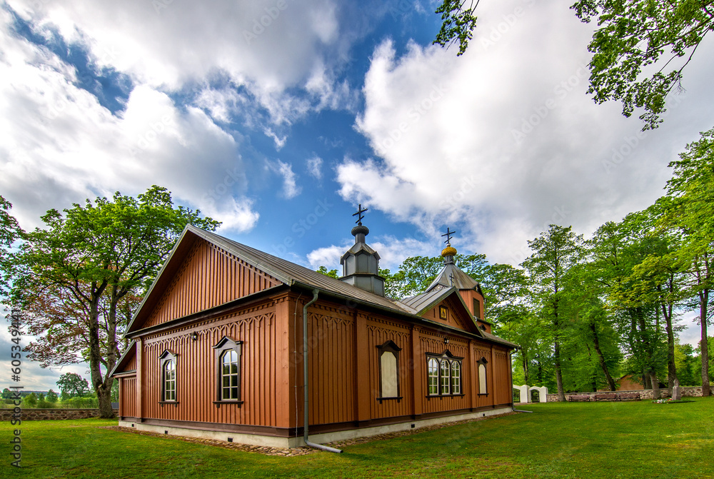 General view and architectural details of the temple of the Orthodox Church of the Holy Apostles Peter and Paul built of wood in 1867 in Samogród, Podlasie, Poland.