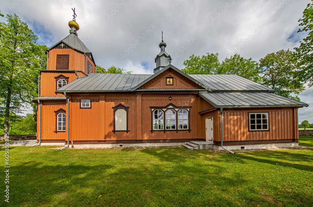 General view and architectural details of the temple of the Orthodox Church of the Holy Apostles Peter and Paul built of wood in 1867 in Samogród, Podlasie, Poland. General view and architectural details of the temple of the Orthodox Church of the Holy Apostles Peter and Paul built of wood in 1867 in Samogród, Podlasie, Poland.