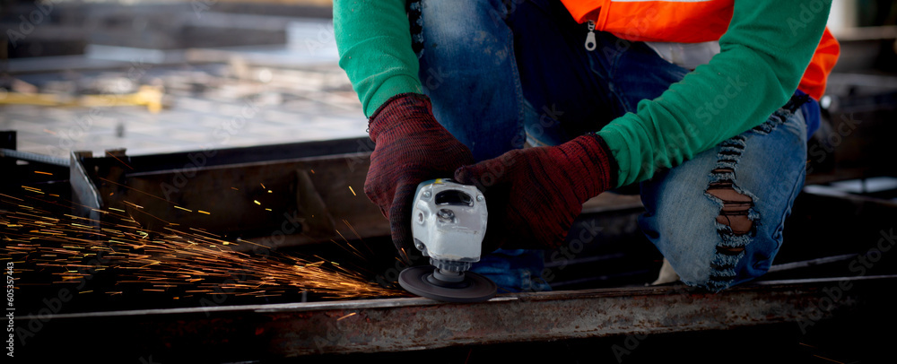 Young asian worker using grinder cut iron with hands working in industrial factory, welder man or labor cut steel while having sparkle, occupation technician and skill, industry concept. Young asian worker using grinder cut iron with hands working in industrial factory, welder man or labor cut steel while having sparkle, occupation technician and skill, industry concept.