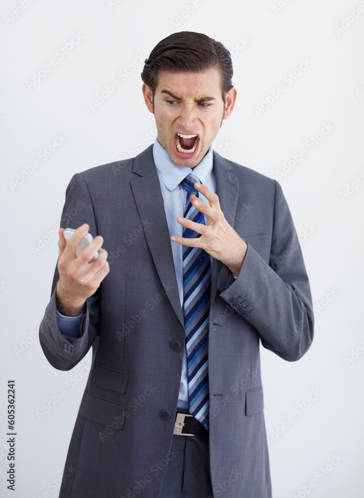 Fail, phone call and business man angry, annoyed and screaming in studio on white background. Stress, anger and male person annoyed with phishing, delay and conversation with bad connection problem Fail, phone call and business man angry, annoyed and screaming in studio on white background. Stress, anger and male person annoyed with phishing, delay and conversation with bad connection problem
