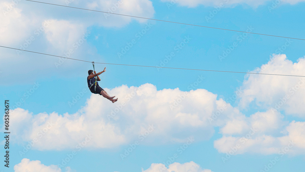 image of a young boy doing zip lining , Paschim Vihar, Delhi, India- 15 May 2022 image of a young boy doing zip lining , Paschim Vihar, Delhi, India- 15 May 2022