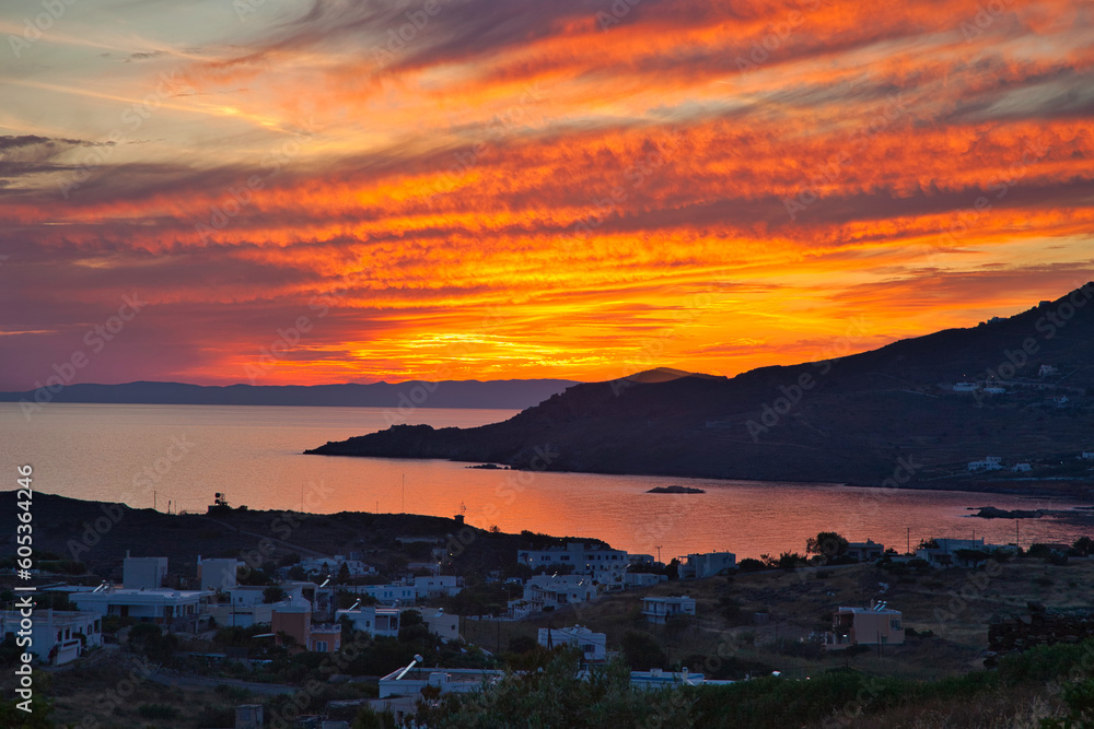 Sunset Over The Sea. Dramatic red cloudscape over Finikas Bay in Syros Island, Greece. Stock Image.