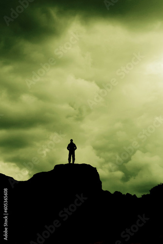 man silhouette standing on a hill © Visualmind