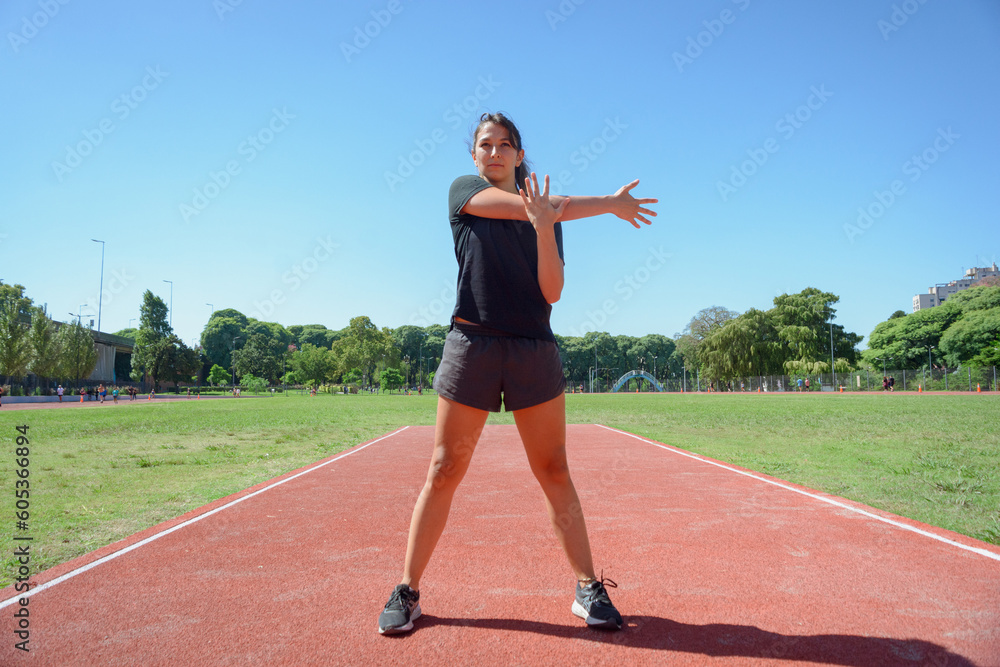 front view of young latin woman training in sports circuit. front view of young latin woman training in sports circuit.