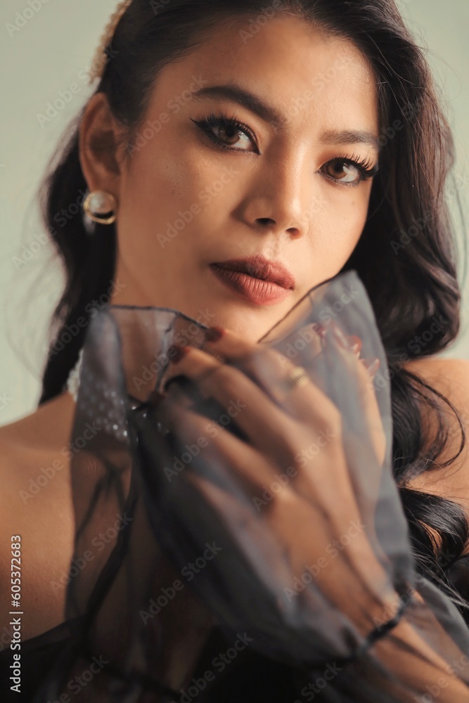 Beautiful woman long black curly hair in black dress retro vintage style, Portrait Beautiful model with makeup red lip vintage style. Beautiful woman long black curly hair in black dress retro vintage style, Portrait Beautiful model with makeup red lip vintage style.