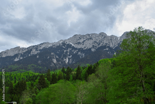 Mountains of Bucegi on a cloudy day from Plaiul Foii , Brasov Romania
