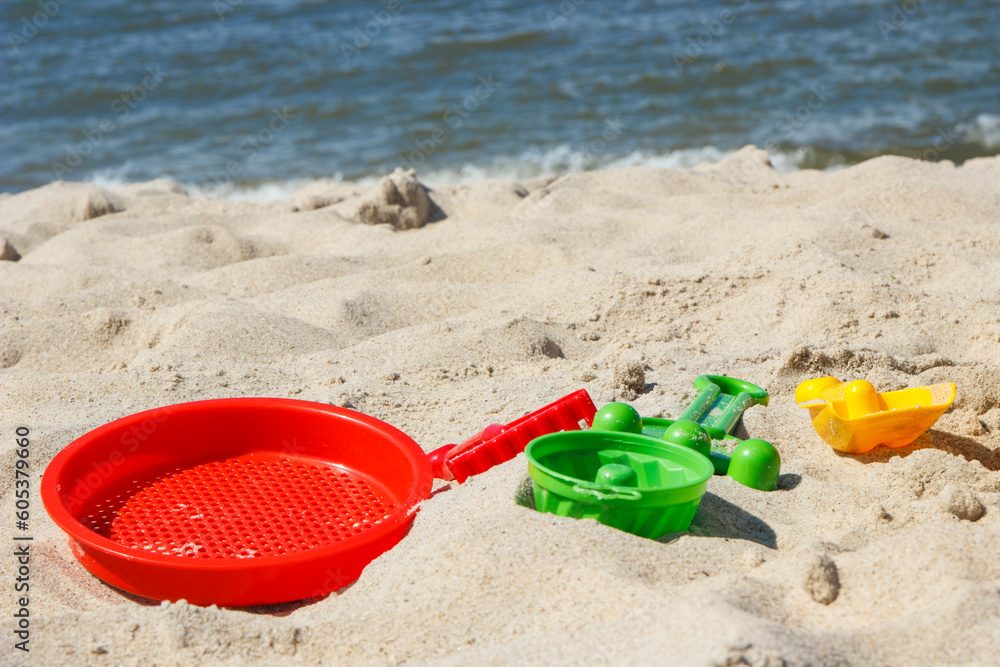 Children toys for relax or playing at beach. Summer, vacation time and child development Children toys for relax or playing at beach. Summer, vacation time and child development