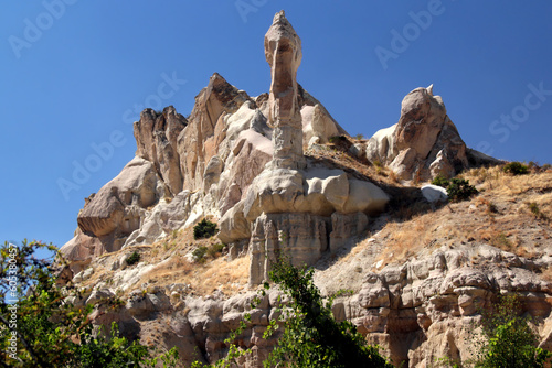 Cappadocia, Turkey. Landscape with rocks in the shape of mushrooms (also called Fairy Chimneys) in the Pigeon Valley between the towns of Goreme and Uchisar. 