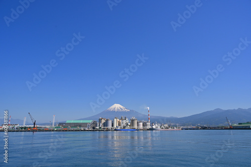 Fuji Mountain and Fisherman boats with Japan industry factory area background view from Tagonoura Fisheries Cooperative cafeteria, Fuji City, Shizuoka prefecture, Japan