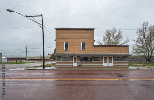 Rainy landscape of an abandoned building on the Yellowstone Highway at Glendo, Wyoming, USA photo