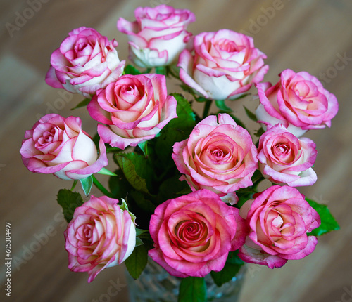 Bouquet of rose flowers on blurred background  horizontal orientation