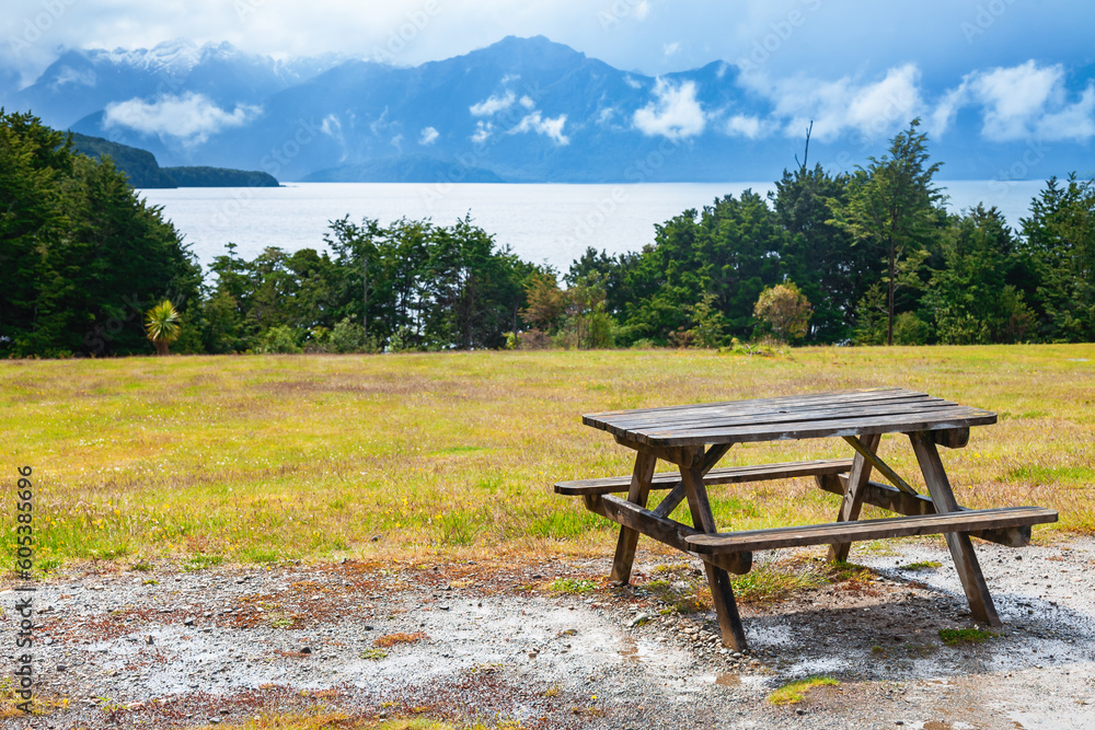 Picnic table overloking Manapouri Lake in Southland South Island New Zealand Picnic table overloking Manapouri Lake in Southland South Island New Zealand