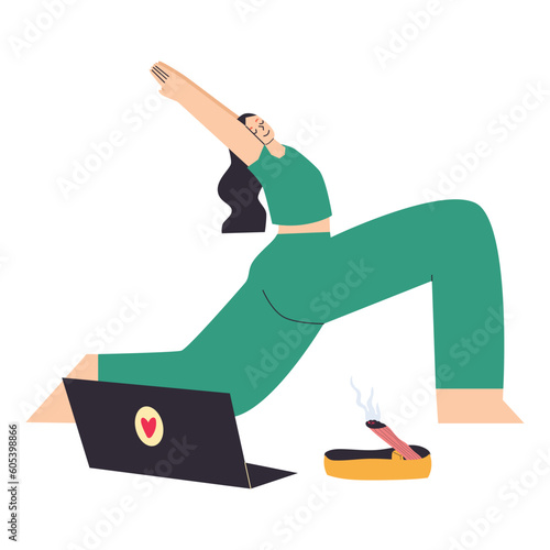 Yong woman watching online yoga classes on laptop, practicing yoga at home.