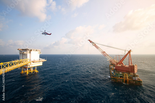 Installation oil and gas platform project in the gulf or the sea by crane barge. The project was support oil and gas industry. The heavy lift was performed by high technical and engineering.