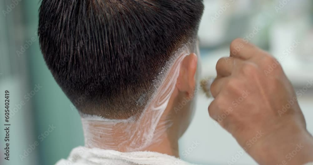 Barber applying shaving foam on beard of client.Male barber cuts customer's hair with razor.Professional barber trim customer hair with straight razor.Handsome man getting his trim hair in barber. Barber applying shaving foam on beard of client.Male barber cuts customer's hair with razor.Professional barber trim customer hair with straight razor.Handsome man getting his trim hair in barber.