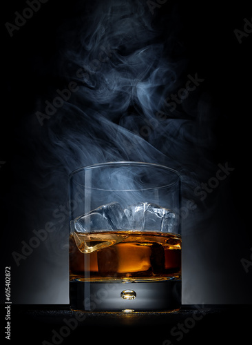 Whiskey with ice and smoke