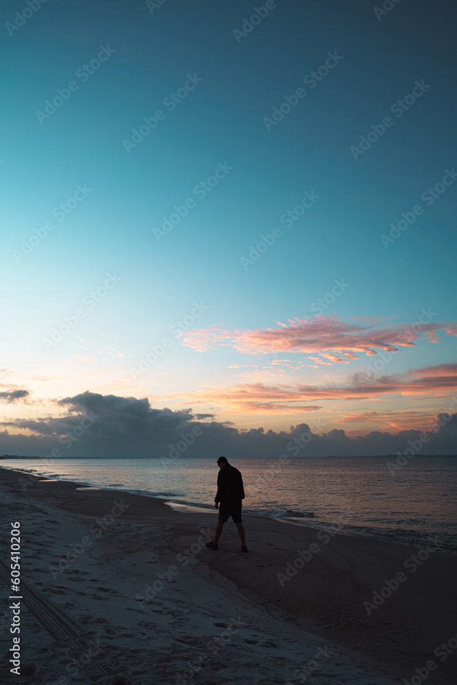 Man Walking During Sunrise on the Beach 2