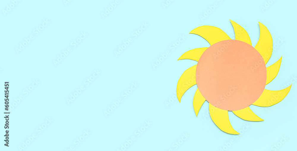 Sun made of paper on light blue background with space for text