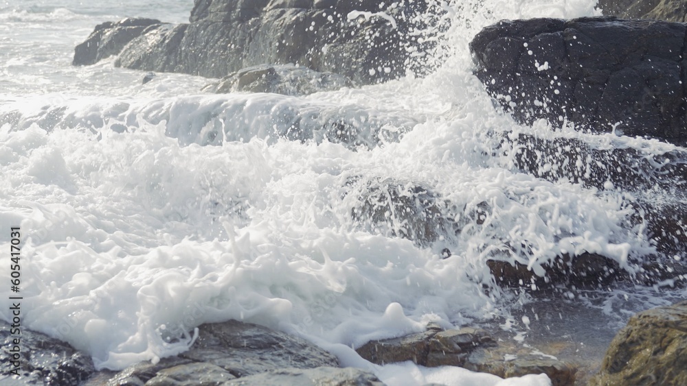 Waves are crashing against the coastal rocks on the seaside Waves are crashing against the coastal rocks on the seaside