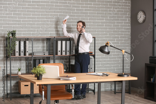 Young businessman throwing ...