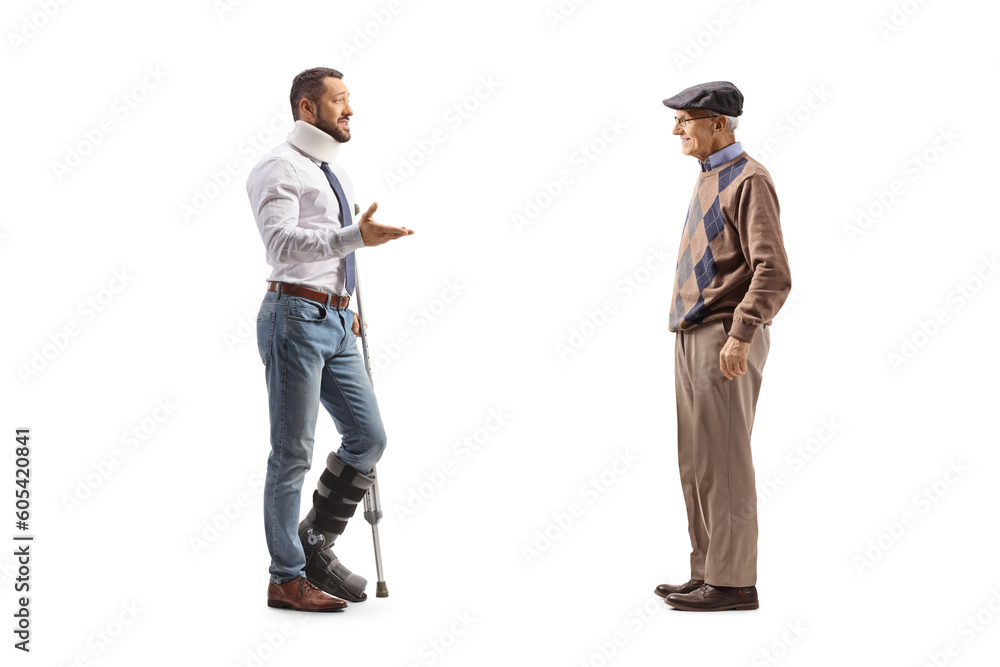 Full length profile shot of an injured man with a crutch talking to an elderly man Full length profile shot of an injured man with a crutch talking to an elderly man