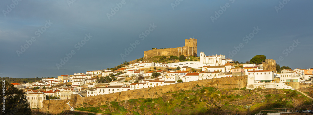 Fototapeta premium View in panorama format of the historical walled city of Mertola on a hill in the south of Portugal 